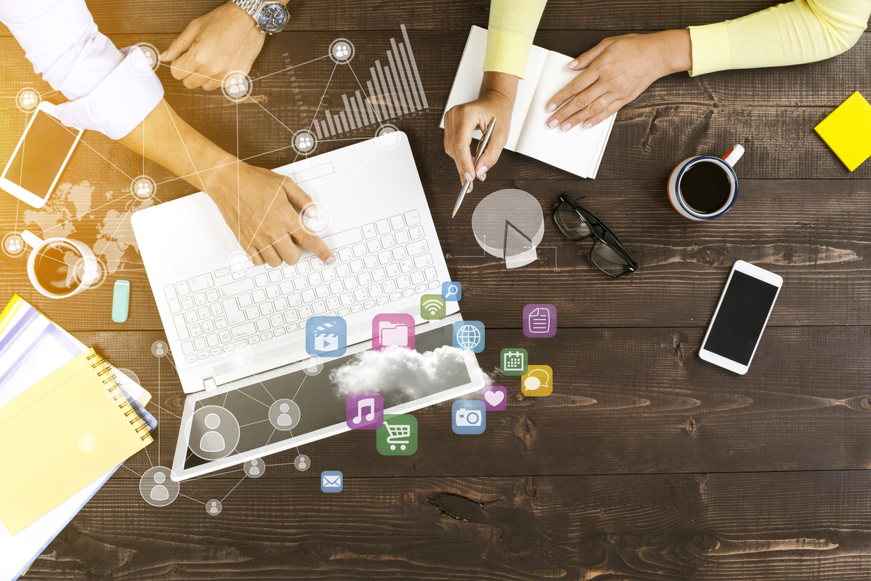 Two people working on computer